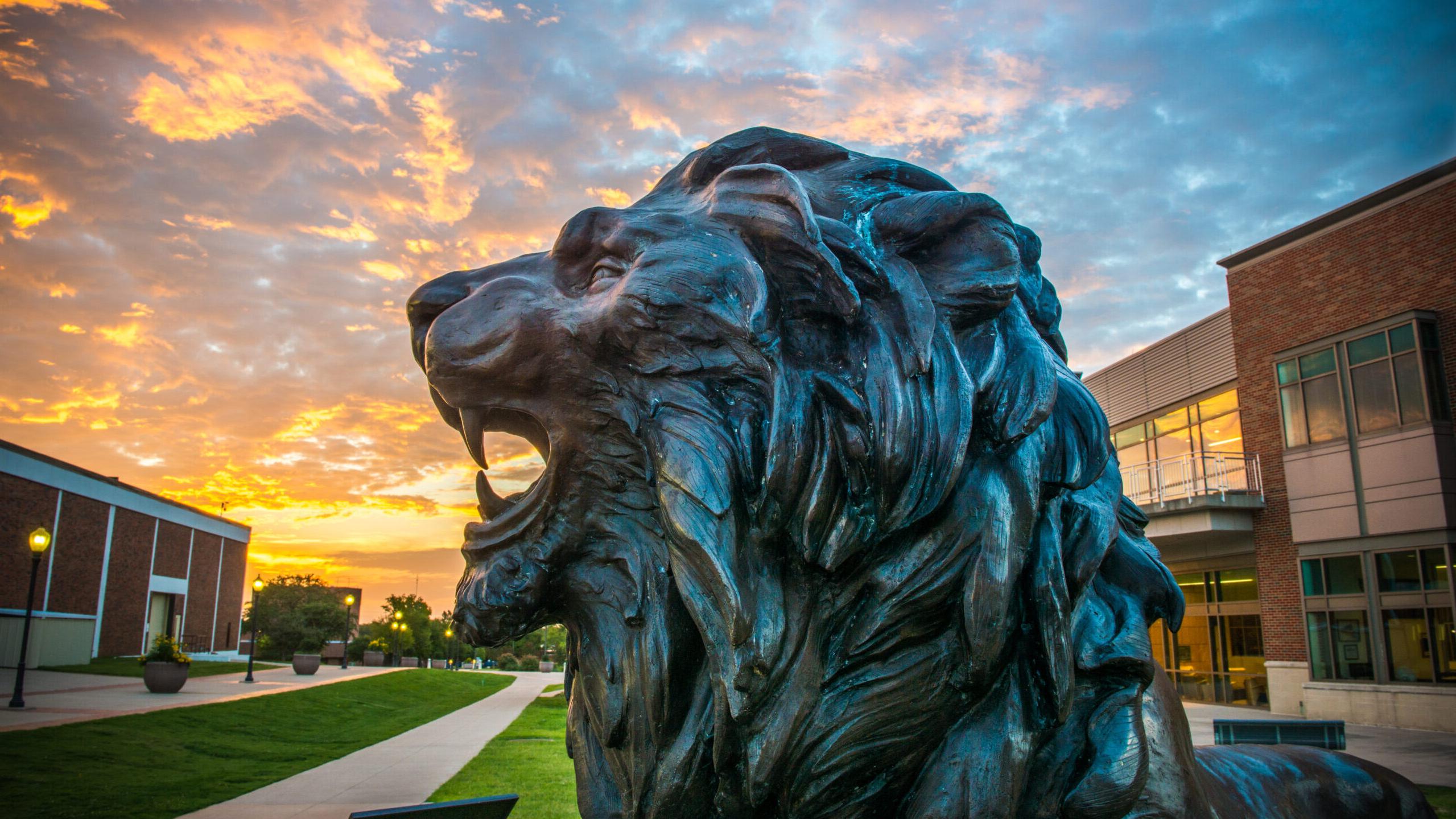 TAMUC lion statue at dusk